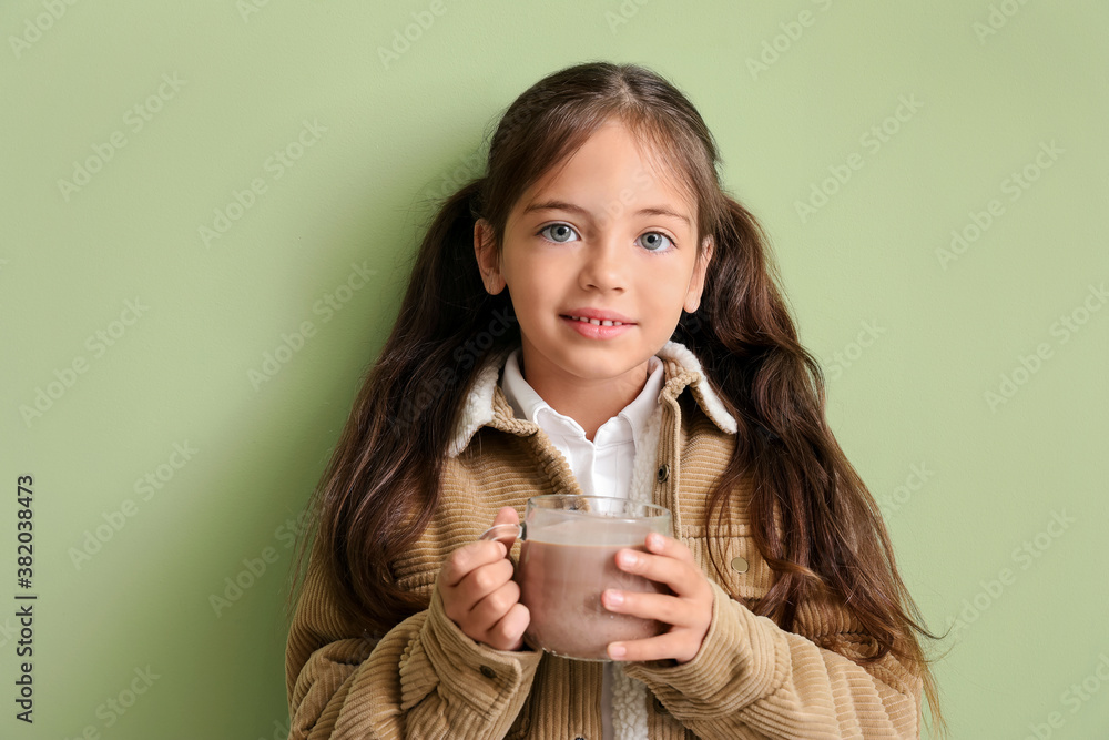 Little girl with tasty chocolate milk on color background Little girl with tasty chocolate milk on color background