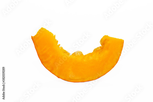 Ripe orange pumpkin and slices isolated on a white background