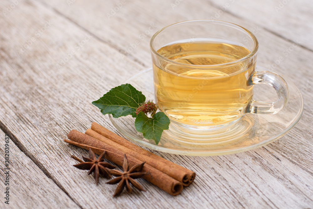 cup of hot mulberry tea with cinnamon spice cup of hot mulberry tea with cinnamon spice