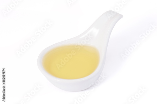 Soy oil in bowl isolated on white background.