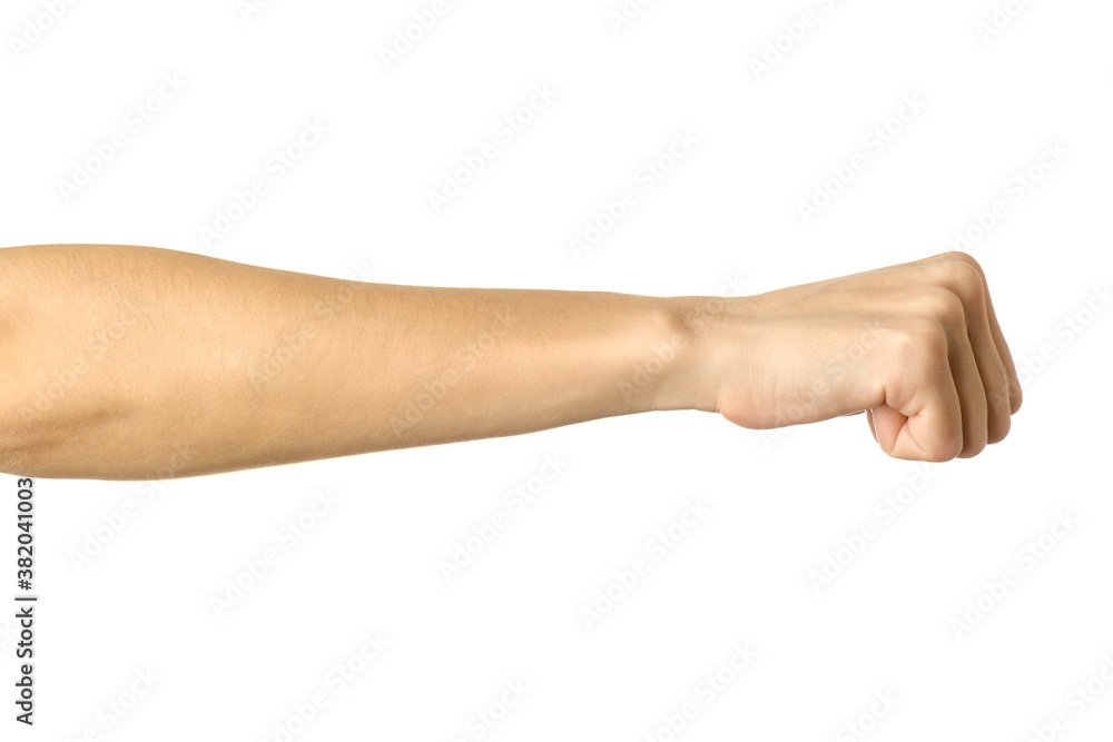 Hand clenched in a fist. Woman hand gesturing isolated on white Hand clenched in a fist. Woman hand gesturing isolated on white