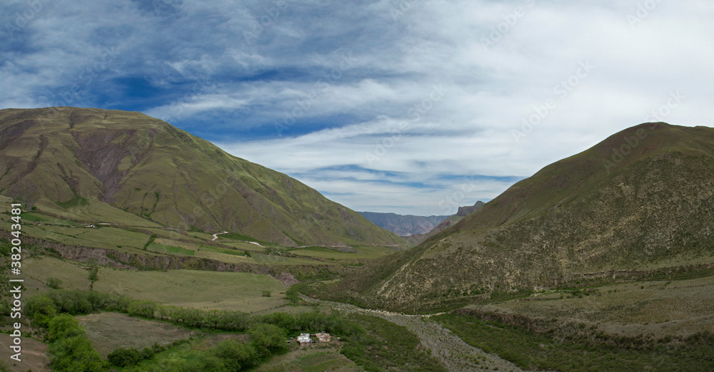 Popular landmark Bishop's slope in Salta, Argentina. Panorama view of the green valley, field and hills under a beautiful sky with clouds. 