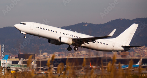 Take off passenger plane in the sky. Airport Barcelona. High quality photo