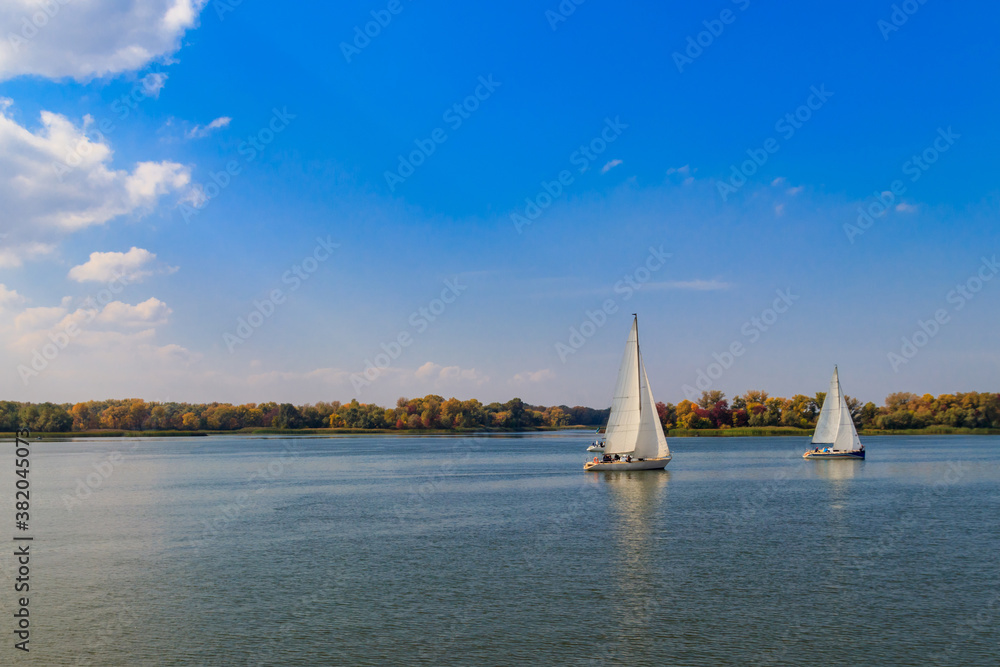 Yachts at sailing regatta on the Dnieper river in Kremenchug, Ukraine Yachts at sailing regatta on the Dnieper river in Kremenchug, Ukraine