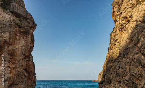 Sunny day over the rocks and the blue water in Sa Calobra, Palma de Mallorca, Balearic Islands, Spain