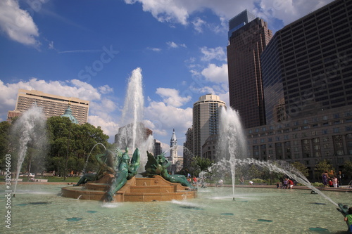 View of Philadelphia City Hall and cityscape with Skyscraper and Swann Memorial Fountain at Logan square traffic circle during summer in Philadelphia