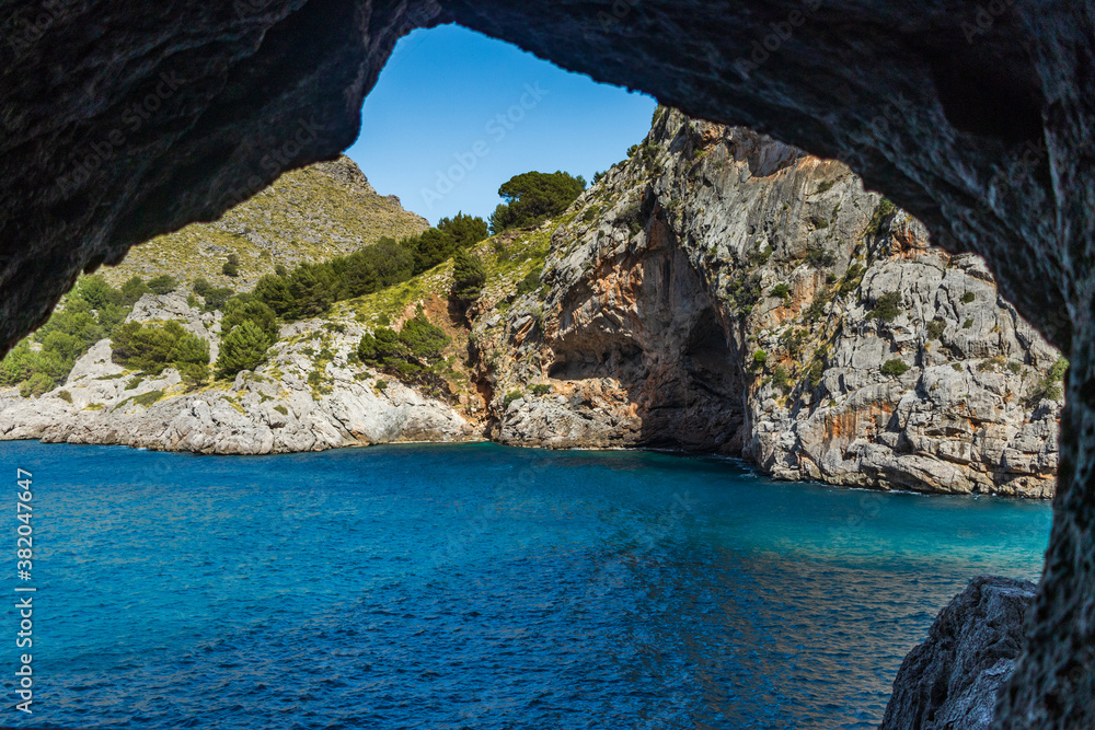 Sunny day over the rocks and the blue water in Sa Calobra, Palma de Mallorca, Balearic Islands, Spain