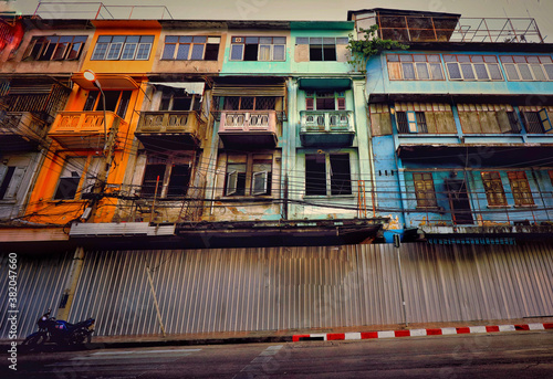 Old and derelict apartment buildings on Yaowarat Road or Chinatown in Bangkok City