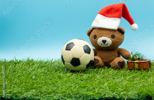 Football for Soccer on Christmas Holiday with ornament on green grass © thaninee