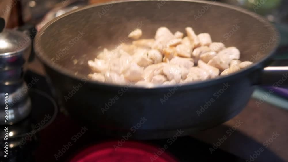cooking chicken meat, roasting chicken meat in a pan in the kitchen by an italian cook.
Location: Italy cooking chicken meat, roasting chicken meat in a pan in the kitchen by an italian cook.
Location: Italy