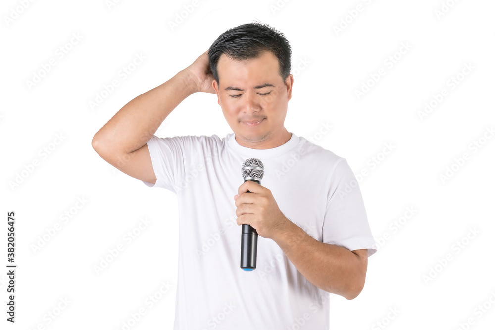 Worry or forget about speech concept. Portrait Asian man holding black wireless microphone and feel worry to speak studio Isolated on white Worry or forget about speech concept. Portrait Asian man holding black wireless microphone and feel worry to speak studio Isolated on white