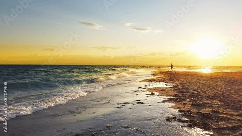 Wallpaper Mural Beautiful vibrant sunset on beach with a waves splashing the shore Torontodigital.ca
