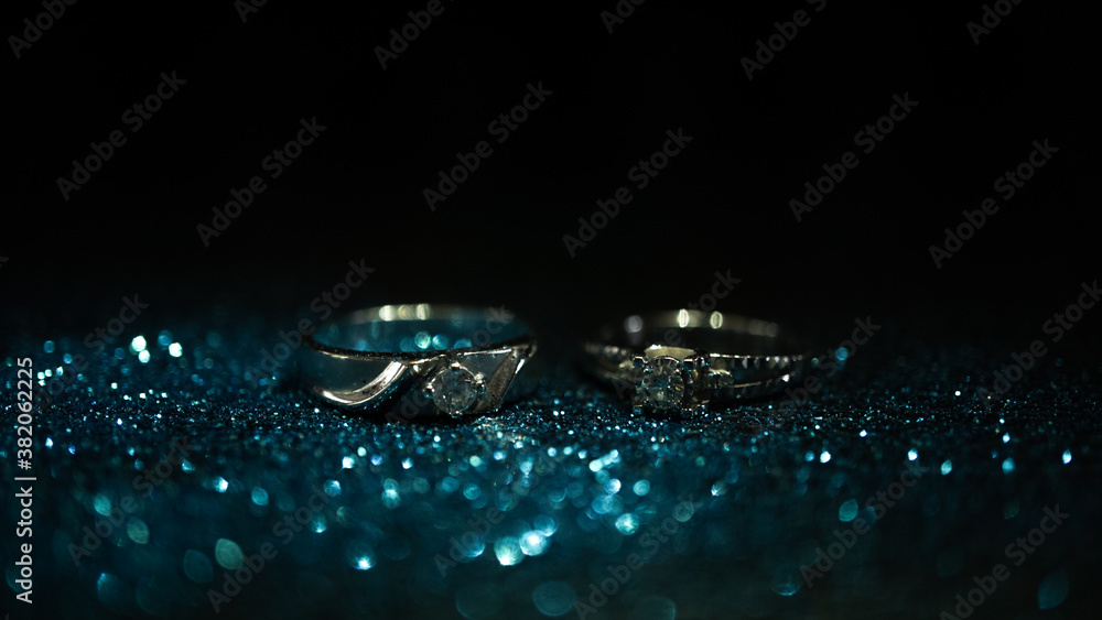 Two Ring and Blue Glitter with dark Background
