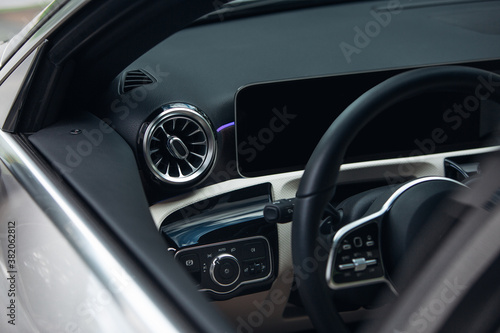 Modern suv car interior with leather panel, multimedia and dashboard © Moose
