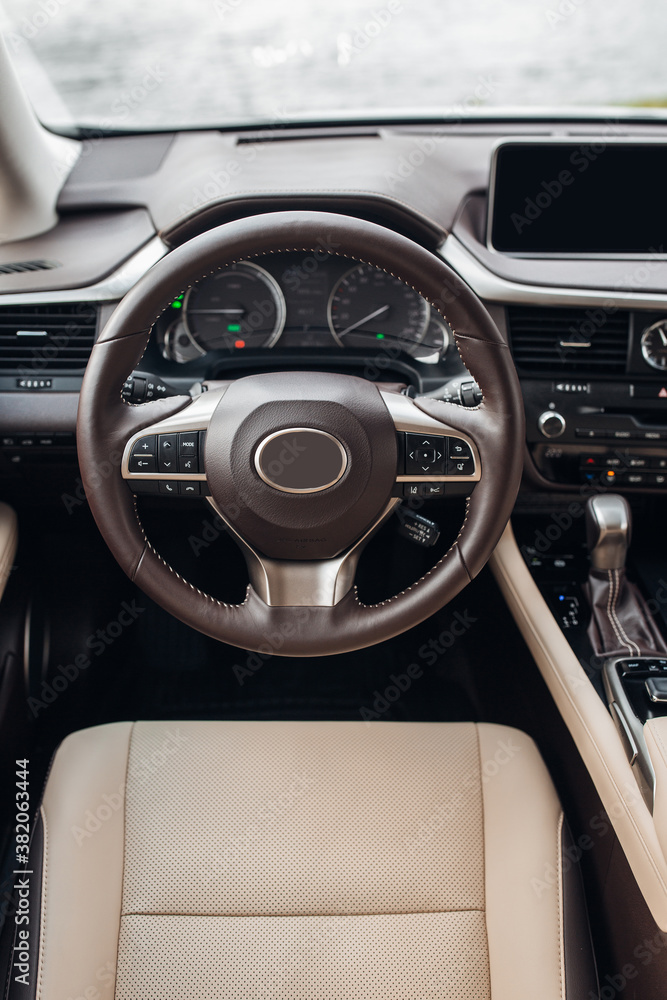 Modern suv car interior with leather panel, multimedia and dashboard Modern suv car interior with leather panel, multimedia and dashboard