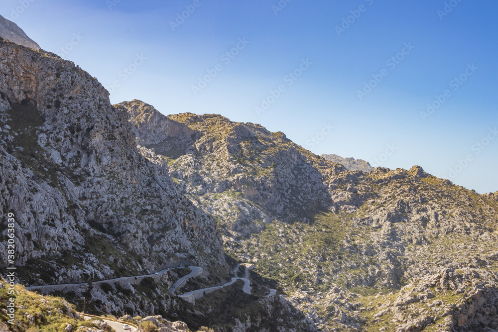 Sunny day over the rocks and the blue water in Sa Calobra, Palma de Mallorca, Balearic Islands, Spain