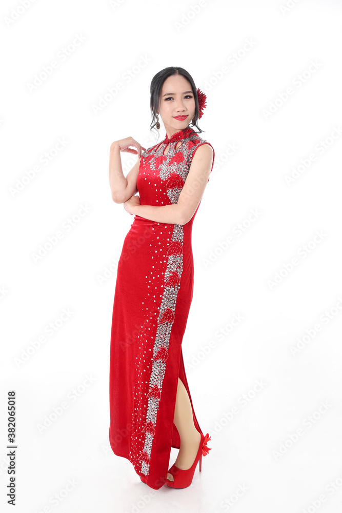 South east Asian Chinese race ethnic origin woman wearing red velvet cheongsam with hand stitched sequence work dress costume on white background South east Asian Chinese race ethnic origin woman wearing red velvet cheongsam with hand stitched sequence work dress costume on white background