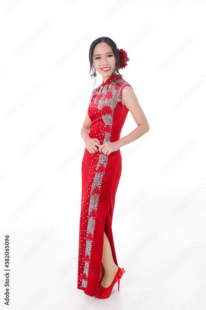 South east Asian Chinese race ethnic origin woman wearing red velvet cheongsam with hand stitched sequence work dress costume on white background South east Asian Chinese race ethnic origin woman wearing red velvet cheongsam with hand stitched sequence work dress costume on white background