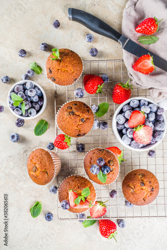 Vanilla muffins or cupcakes with berries