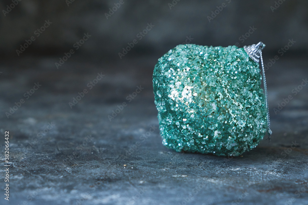 Christmas green toy ball on gray background Copyspace Christmas green toy ball on gray background Copyspace