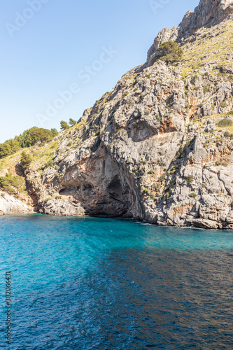 Sunny day over the rocks and the blue water in Sa Calobra, Palma de Mallorca, Balearic Islands, Spain © Adelin
