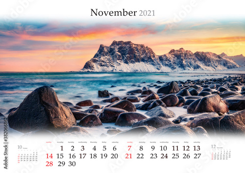 Calendar November 2021, B3 size. Set of calendars with amazing landscapes. Splendid autumn sunrise on Haukland Beach, Vastvagoy. Perfect morning scene of Lofoten Island, Norway, Europe. photo