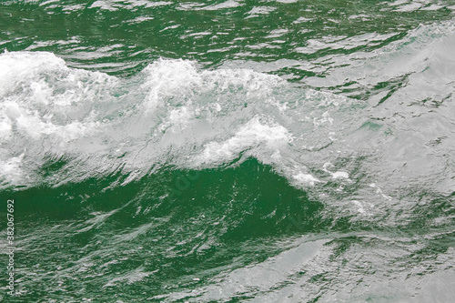 Green turquoise water with waves. Texture from above, Sognefjord Norway. photo