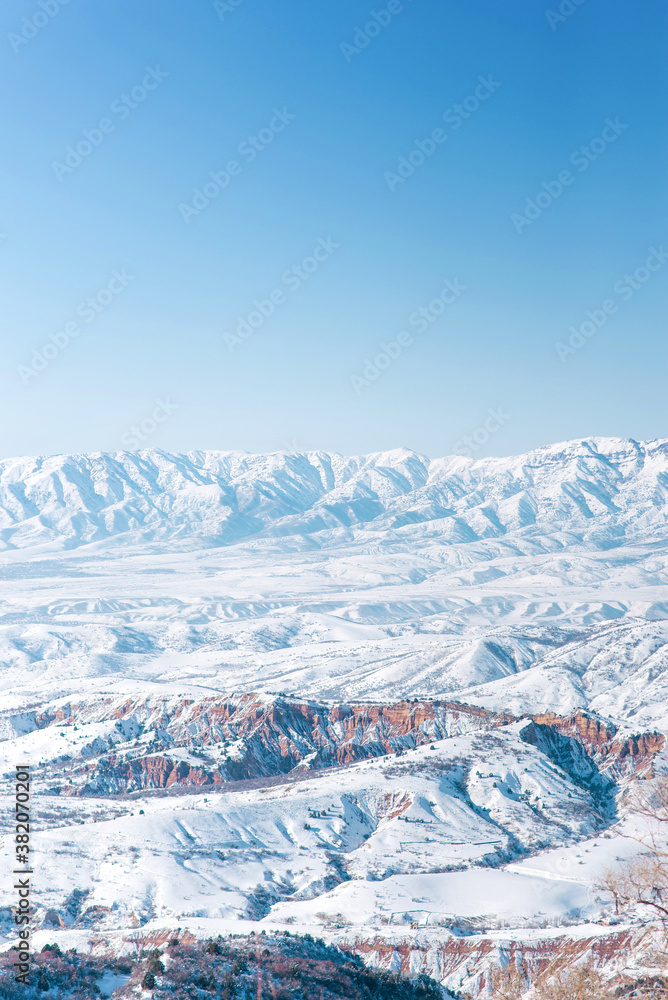 The Tien Shan mountain range in winter. The view from the pass Beldersay Uzbekistan