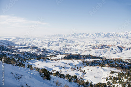 Location of the Tian Shan mountains, Uzbekistan, Central Asia. Incredible beauty of the winter landscape. Beldersay ski resort