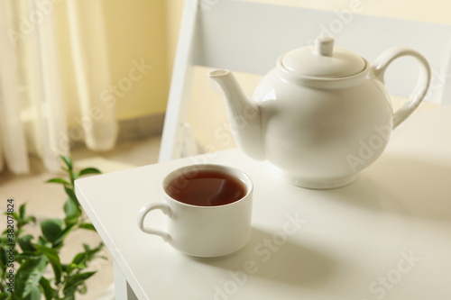 Concept of breakfast with tea on white table