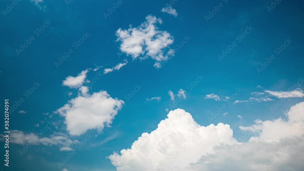 Movement of white clouds on the blue sky in daytime of rainy season. Time lapse. Movement of white clouds on the blue sky in daytime of rainy season. Time lapse.