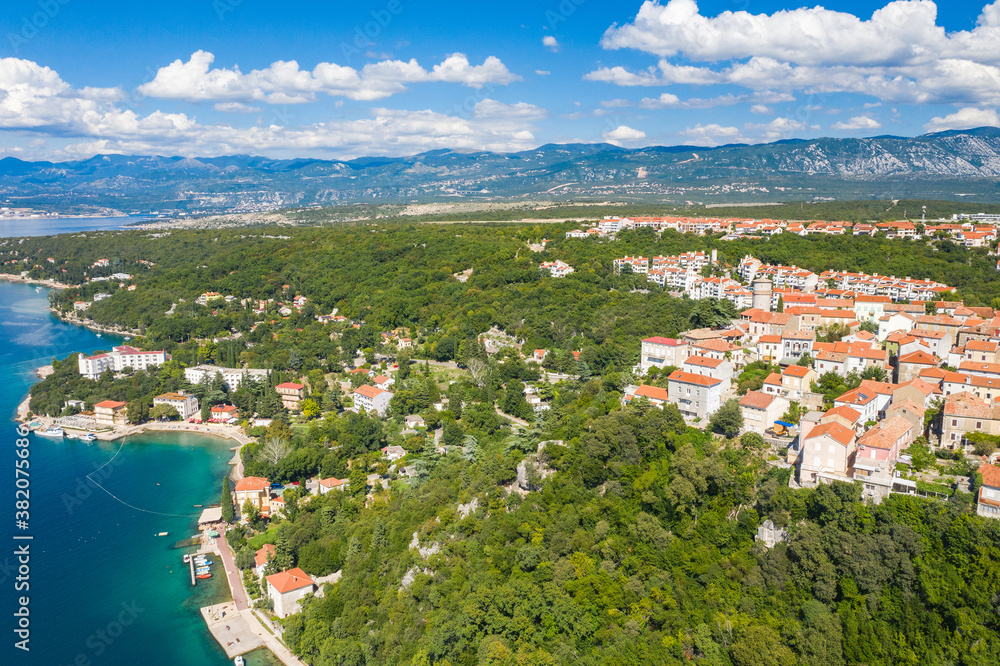 Drone aerial view of the island of Krk, beautiful Adriatic coastline and town of Omisalj. Kvarner bay, Croatia.