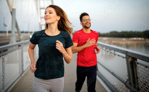 Sport couple. Young man and woman jogging outdoor