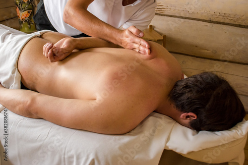 closeup masseur doing body massage