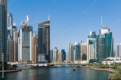 Photography Residential towers and villas of Dubai Marina at a sunny day