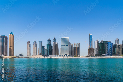 Cityscape skyscrapers of downtown of Dubai, UAE at Dubai Canal, Business Bay. Modern skyline of the capital of the Emirate of Dubai. A center of international business and new tech of Western Asia © VideoFlow