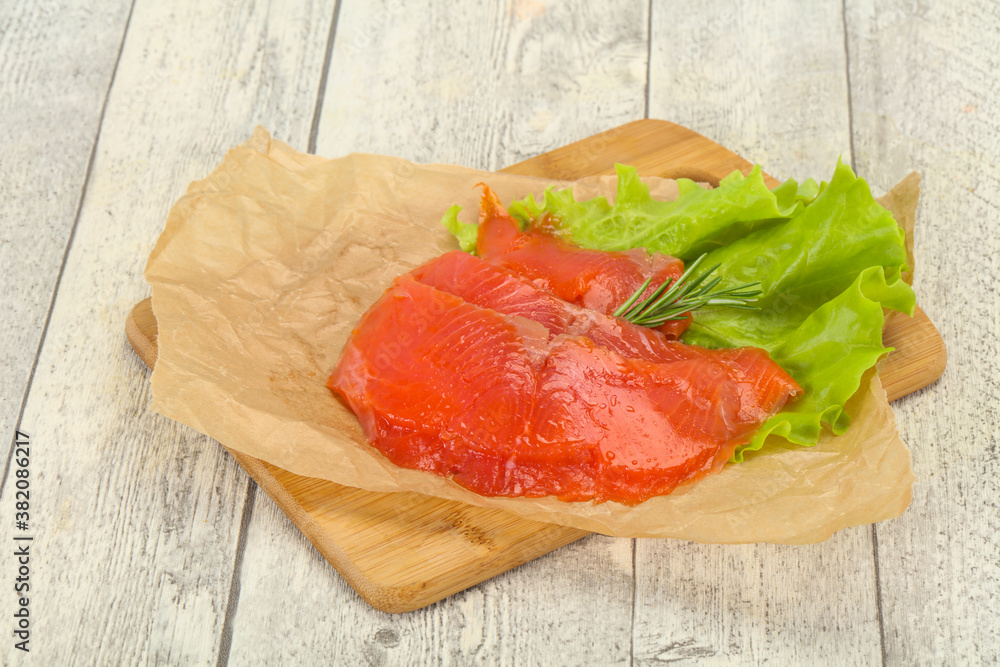 Sliced salmon fillet served rosemary Sliced salmon fillet served rosemary