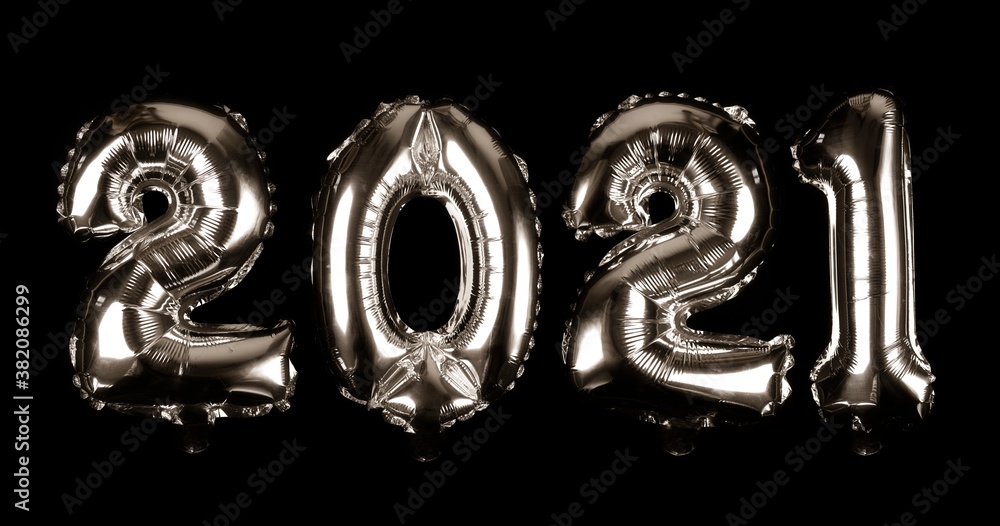 Celebration of New Year 2021 made from silver Number Balloons isolated in black background. Celebration of New Year 2021 made from silver Number Balloons isolated in black background.
