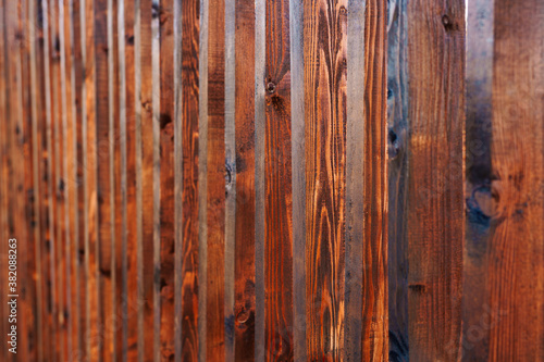 Shallow depth of field brown wooden planks in a row.