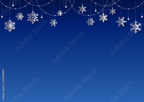 雪の結晶がぶら下がった キラキラ イルミネーションのクリスマス背景 フレーム 青