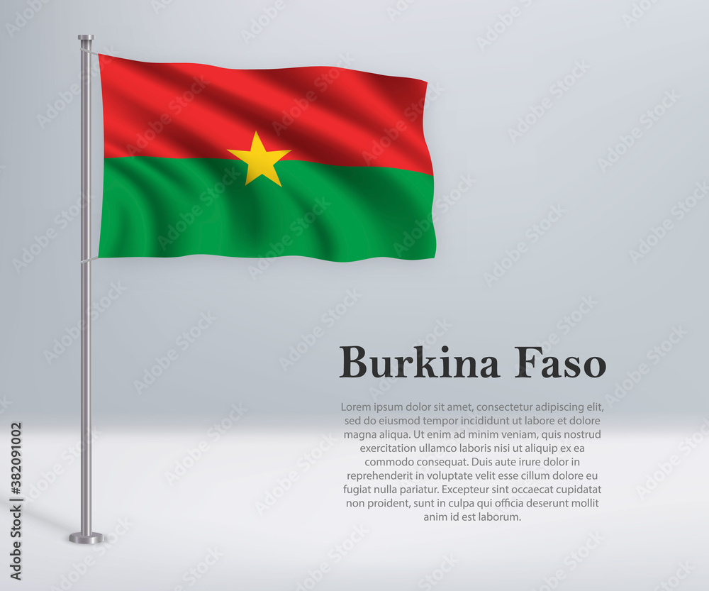 Waving flag of Burkina Faso on flagpole. Template for independence day