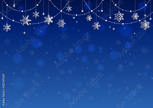 雪の結晶がぶら下がった キラキラ イルミネーションのクリスマス背景 フレーム 青