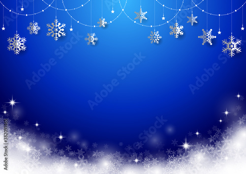 雪の結晶がぶら下がった キラキラ イルミネーションのクリスマス背景 フレーム 青