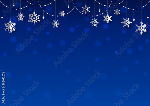 雪の結晶がぶら下がった キラキラ イルミネーションのクリスマス背景 フレーム 青
