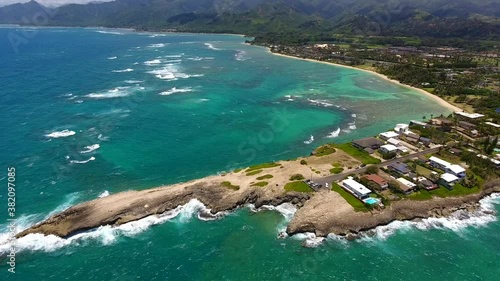 Aerial  Laie Point, North Shore of Oahu Hawaii. Scenic views of the ocean lapping against the rocky coast and the offshore seabird sanctuary await visitors to Laʻie Point State Wayside.