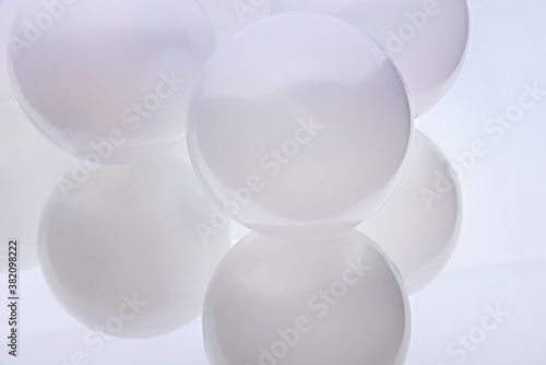 Abstract background. Large white pearl balls. Close view.