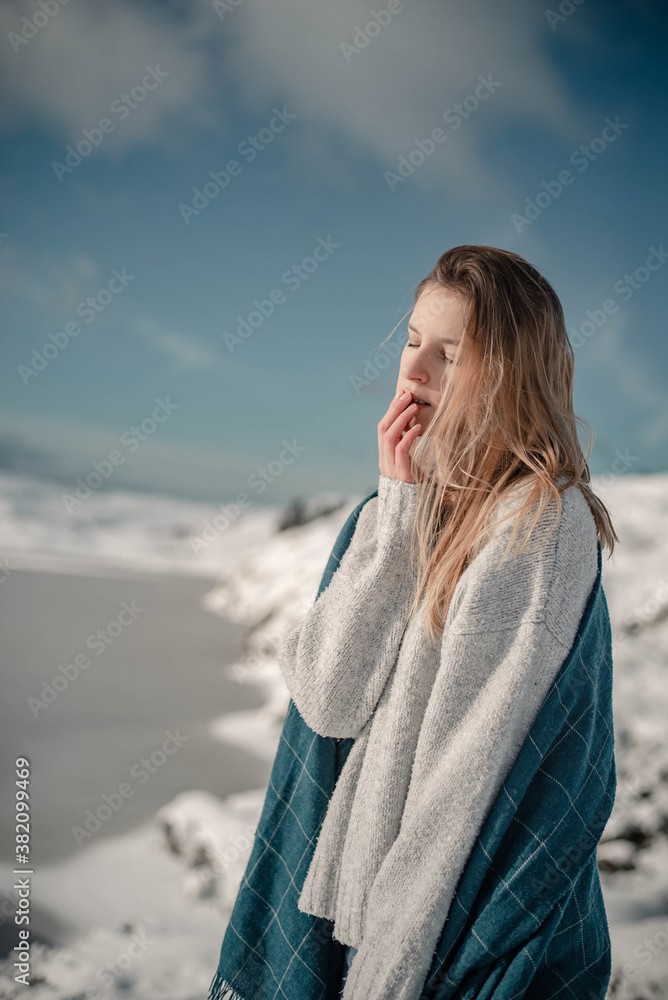 Woman enjoying winter in Norway covered with blanket. Dreamy lifestyle portrait in scandinavian nature. Woman enjoying winter in Norway covered with blanket. Dreamy lifestyle portrait in scandinavian nature.