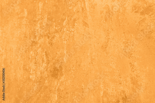 Saturated orange pastel colored low contrast Concrete textured background with roughness and irregularities. 2021  2022 color trend.