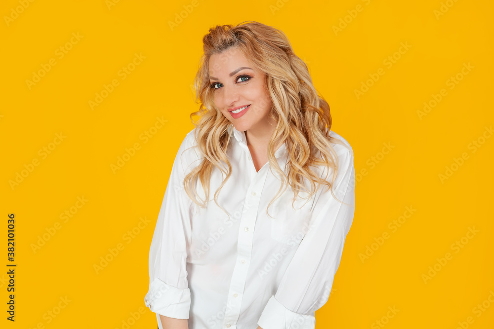 Blind woman in a white shirt, middle-aged European girl, laughs carefree cheerfully smiling, happily leaning forward cute silly, posing. Giggles, looks coquettishly, standing on a yellow background Blind woman in a white shirt, middle-aged European girl, laughs carefree cheerfully smiling, happily leaning forward cute silly, posing. Giggles, looks coquettishly, standing on a yellow background