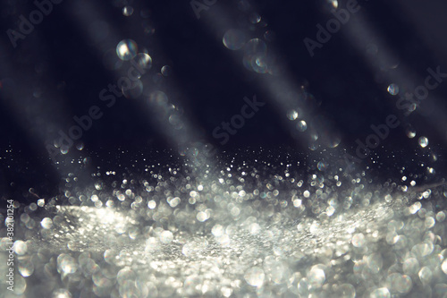 background of abstract silver and black glitter lights. defocused

